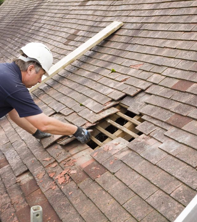 Roof-Repair-scaled-1 Expert roof replacement team working on a home in Westchester County, NY.